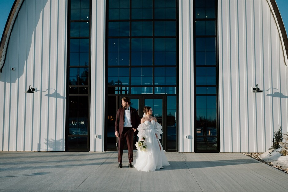 Wedding Photo of a couple in front of a modern barn venue