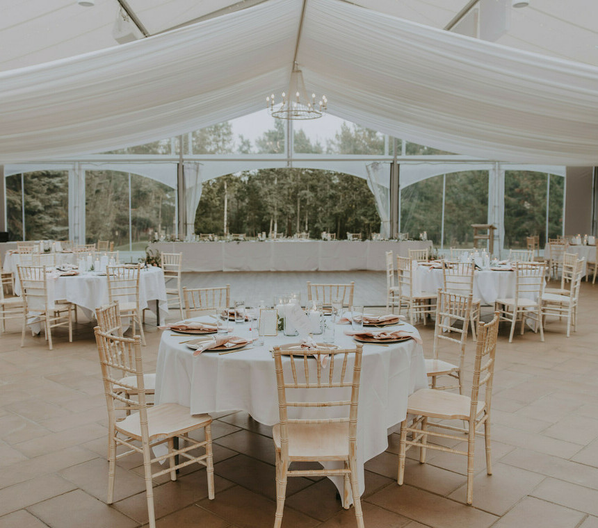 Special Event Rentals - Outdoor tent wedding with quest tables along with head table