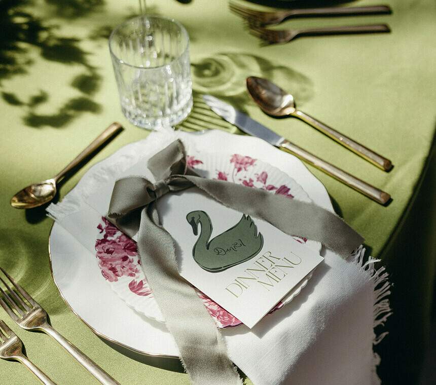 Special Event Rentals - Table setting with charger plates, napkins, flatware and linen