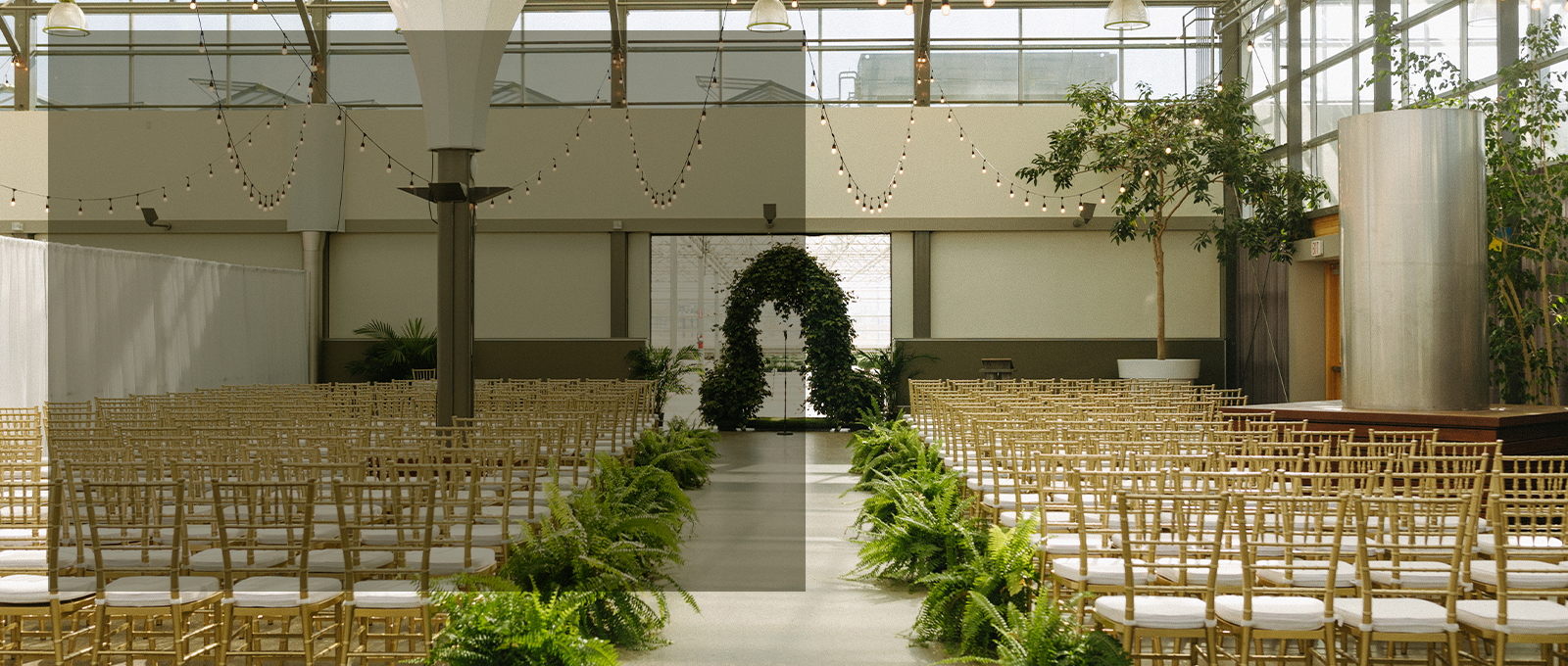Indoor Floral Wedding With Green Archway